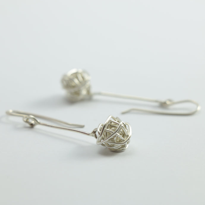Pōro (ball) earrings